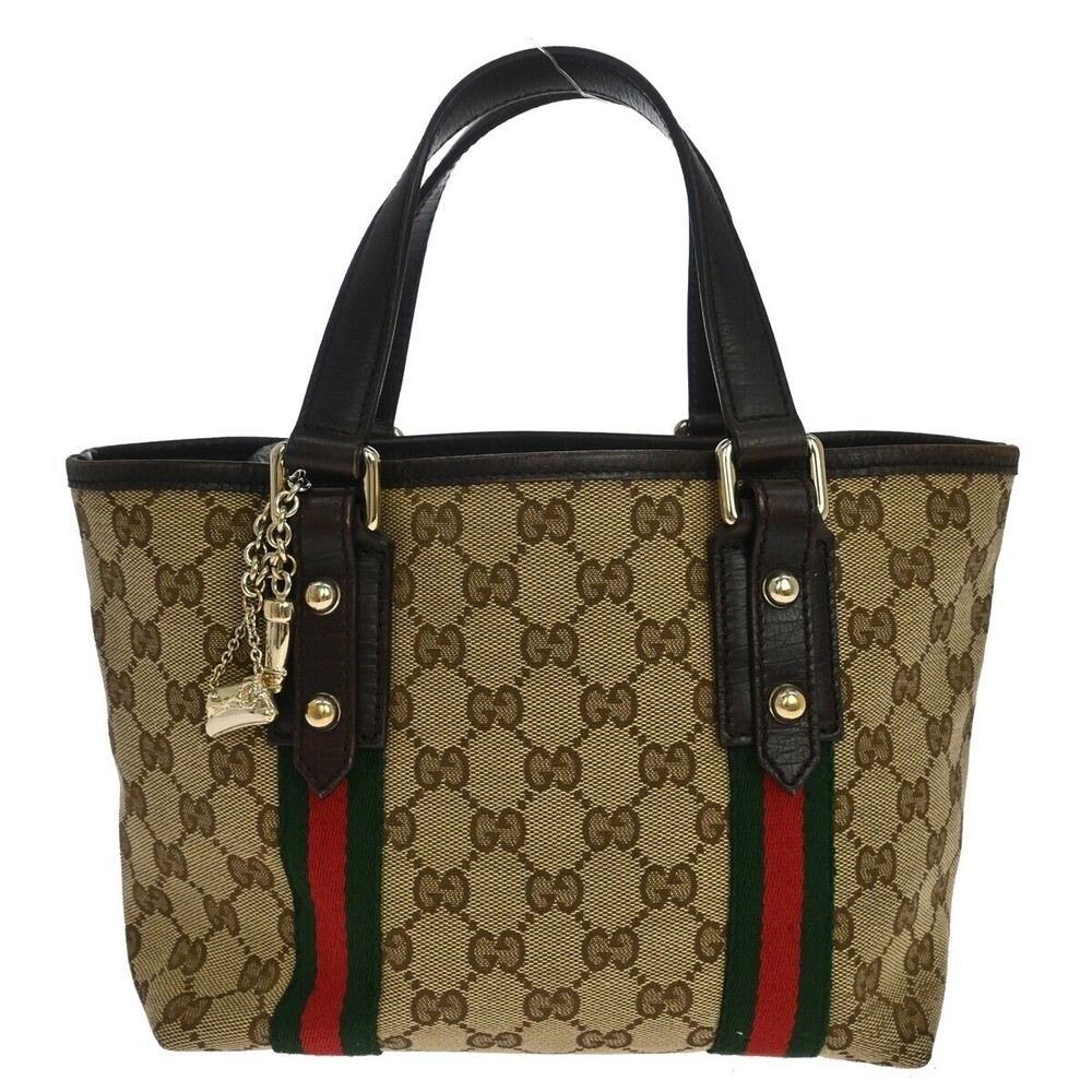 Gucci Jolicoeur Pochette GG Canvas and leather